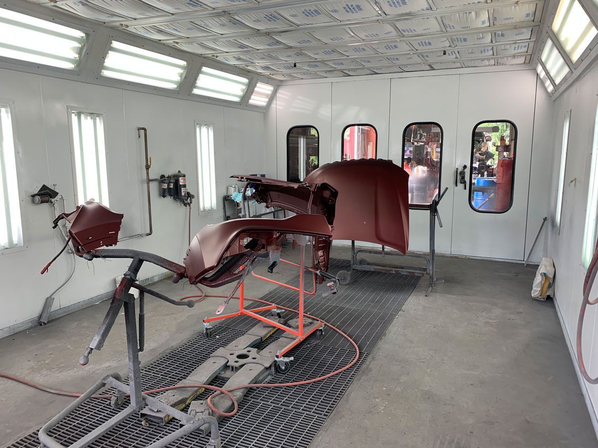 Collision repair parts prepared inside Gino's paint booth